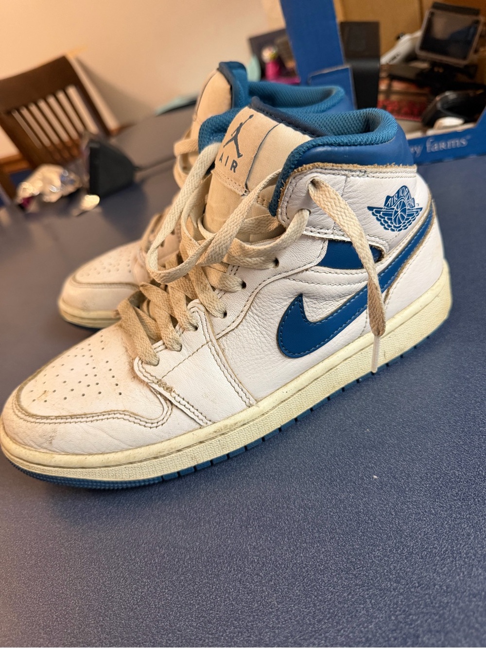 Nike Air Jordan 1 Mid White and Blue Retro Sneakers